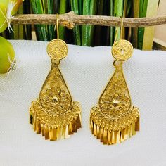 Beautiful and stunning handmade Mexican Filigree Earrings. Each piece is meticulously created out of copper wire and spun into a beautiful design. To give it the final touch artisans dipped into gold plate for it's gold color. This accessory is an important part of the traditional Tehuana outfit from Oaxaca, Mexico. Look elegant while wearing Mexico's culture with this one of a kind earrings! Approximate length: 3-3.5 in Need more than one? Ask us about our combined flat rate shipments for multi Artisan Gold Earrings With Intricate Design, Bohemian Drop Clip-on Earrings For Wedding, Traditional Brass Dangle Clip-on Earrings, Festival Filigree Drop Earrings Danglers, Traditional Brass Drop Clip-on Earrings, Filigree Drop Earrings For Festivals, Brass Drop Earrings For Festivals, Traditional Gold Teardrop Plug Earrings, Traditional Gold Flower Earrings For Festivals