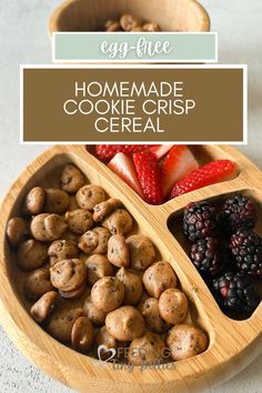 a wooden bowl filled with cookies and berries