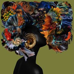 a woman's head is covered in feathers and flowers, as if it were made from an image