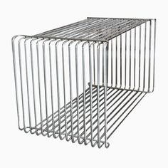 two metal racks stacked on top of each other in the shape of a cube, one with