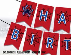 happy birthday banner with spider webs on red and blue banners hanging from clothes pins