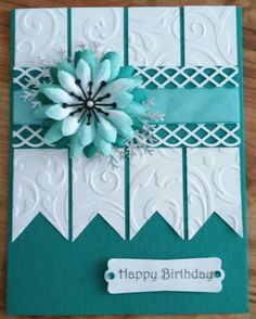 a birthday card with a paper flower on it