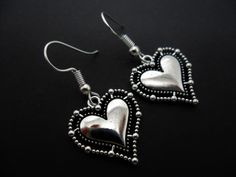 This a pair of pretty tibetan silver heart themed earrings. Measure approx. 3.5cm from top of hook to bottom of earring. These earrings are for pierced ears. Freshly made by me and unworn. Thanks for looking!! Black Dangle Heart Pierced Earrings, Punk Style Heart-shaped Earrings As Gift, Gothic Silver Dangle Earrings, Heart-shaped Black Earrings, Gothic Black Heart-shaped Earrings, Heart Themed, Pretty Hands, Dangly Earrings, Silver Heart