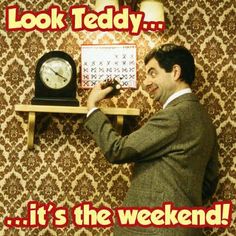 a man in a suit holding a clock and pointing at it with the words, look teddy it's the weekend