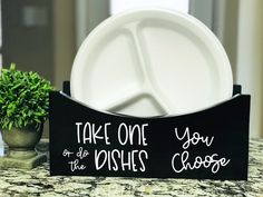 there is a black sign that says take one of the dishes you choose on it