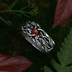 "Picture the allure of a forest berry--now imagine that rich red gem gracefully adorning your finger, captivating every gaze. This new \"Audrey\" ring boasts nature-inspired designs, featuring meticulously crafted Sterling Silver leaves entwining around the band. Whether it graces your finger as an engagement or promise ring or serves as a cherished anniversary gift, this piece is a timeless embodiment of love and beauty. Let the red Garnet tell your unforgettable story! DETAILS - 925 Sterling Silver  - Oxidized antique finishing - Amazing Natural Amber - Amber size: 5mm diameter round - Nature inspired design - Made to order by hands  - Great attention to details - Lifelong Warranty This \"Audrey\" ring is custom made in any size between 5 to 10 in American/Canadian measurement (half and Antique Rings Men, Men Promise Rings, Spiritual Red Rings For Wedding, Amber Ring Men, Mens Amber Ring, Mens Promise Ring Red Garnet, Mens Garnet Ring, Red Gemstone Ring Men, Luxury Handmade Men's Amber Ring