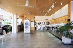 the inside of a store with washing machines