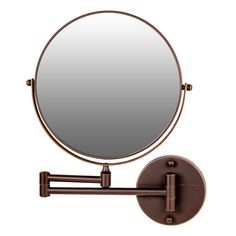 a round mirror mounted to the side of a wall with an arm and two arms