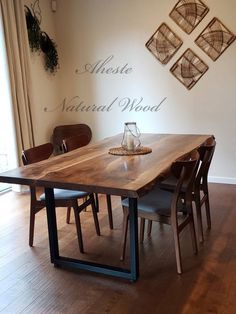 a wooden table sitting in the middle of a room