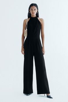 Introducing the luxurious jumpsuit. This sleek and sophisticated jumpsuit features a halter neckline and sleeveless design, perfect for any special occasion. Made from high-quality crepe fabric, it flows elegantly down to the floor for a stunning look. Length:- Black: Front length: 144cm (S/M/L)- White: Front length: 150cm/152cm/154cm (S/M/L). Back length: 117cm/119cm/121cm (S/M/L) Mean Blvd, Crepe Blazer, Cape Sleeves, Office Attire, Crepe Fabric, Halter Neckline, Neck Scarves, Designer Collection, Sleeve Cotton