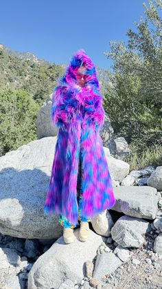 Electric Daisy Faux Fur Coat: Ignite Your Festival Spirit! Step into a world of vibrant energy and dazzling color with the Electric Daisy Fur Coat. Perfect for festivals and a bright, lively lifestyle, this coat will make you the star of any event. Electric Daisy Fur Coat bursts with purple, blue, pink, and turquoise neon colors, reflecting the vivacity and excitement of festival life. Power up your magic with this enchanting boho coat. This coat will be handmade for you in San Francisco. FEATUR Funky Multicolor Winter Outerwear, Funky Long Sleeve Winter Outerwear, Fitted Multicolor Long Outerwear, Long Winter Party Outerwear, Multicolor Winter Outerwear For Costume Party, Multicolor Outerwear For Winter Costume Party, Funky Multicolor Fall Outerwear, Multicolor Outerwear For Fall Costume Party, Blue Outerwear For Costume Party In Fall