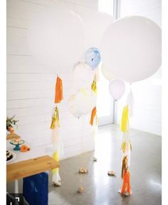 some balloons and tassels are on the floor