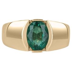 This is a simple and sophisticated unisex emerald ring. The emerald carries a full 2.08-carats and showcases a dark green color, with a bluish-green undertone. It is set in a simple and secure, 14k yellow gold tension setting. The perfect everyday/pinky ring. Setting Style: Solitaire/Tension Metal Purity: 14K Yellow Gold Weight: 6.9 Grams Main Stone: Emerald Shape: Oval Cut Approx Weight: 2.08-carats Clarity: Transparent Color: Green Luster: Excellent-Very Good Treatment: Natural, Oiling Origin: Emerald Mens Ring, Tension Setting, Dark Green Color, Solitaire Setting, Colombian Emeralds, Emerald Engagement, Bluish Green, Mens Ring, Ring Setting