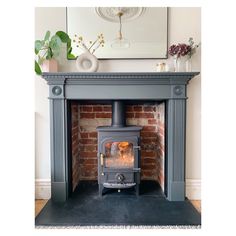 a fireplace with a wood burning stove in it