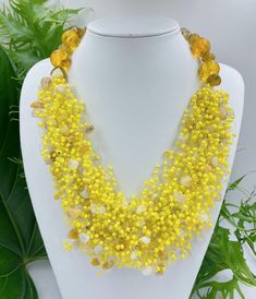 Big bold chunky multi strand handmade necklace. Yellow  beaded statement jewelry gift for women. You can wear this unique Yellow  gemstone jewelry day or evening. Fits perfectly into shirts or summer dresses This necklace can make even an everyday dress stunning. It will be the perfect gift for yourself and a wonderful woman around you. While designing my necklaces, I pay attention to multi-purpose use. It can be used for casual evening or wedding, it's up to you and your choices .  For wife, mo Unique Yellow Necklace For Party, Yellow Beaded Bib Necklaces With Round Beads, Bohemian Yellow Necklaces For Party, Handmade Yellow Necklace For Party, Yellow Multi-strand Bohemian Jewelry, Yellow Bohemian Beaded Necklaces For Party, Yellow Necklaces With Natural Round Beads, Yellow Bohemian Beads For Party, Yellow Necklaces With Natural Stones And Round Beads