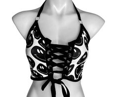 BLACK and WHITE Includes a crop top halter top with a corset front and tie around the neck.  BLACK and WHITE is a 4-way stretch polyester spandex blend, which fits tight and stretches to include a variety of body types. Fabric pattern can vary from item to item. Our products are made to order, please review our store policies before purchasing because refunds are not available after purchase. International shipping available. Rave Top Pattern, Black Rave Tops With Letter Print, Rave Black And White, Fitted Black Rave Tops, Black Rave Crop Top For Streetwear, Black Rave Crop Top, Rave Looks, Festival Outfits Rave, Outfits Rave