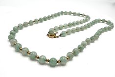 This spectacular tested genuine green aventurine bead necklace features genuine aventurine beads strung  in 28 inches of  gorgeous 8mm beads   Recently purchased from an estate, this piece is an Art Deco necklace. Gorgeous statement. Very special clasp in gold with aventurine on the top.  Hallmark: all pieces tested as aventurine on my Presidium -  Size: Total length - 28 Inches each bead is 8mm in size Follow this link to return to my shop: https://www.etsy.com/shop/VintagObsessions Jade Bead Necklace, 8mm Beads, Art Deco Necklace, Bead Stringing, Jade Beads, Green Jade, Contemporary Jewelry, Jade Green, Green Aventurine