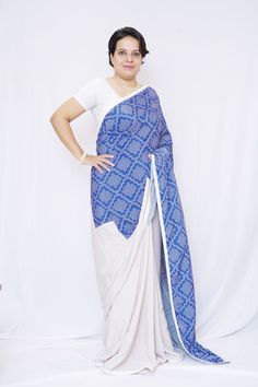 Description Be an absolute grace of splendor with our polyester crepe saree. This casual wear saree is made from the finest polyester crepe that is available in our country. It is digitally printed with modern designs that complement the satin saree perfectly. Specifications: Brand- Mudita by Lejina Fabric- Polyester Crepe Saree Length- 6.5m Print type- Digital Print Saree Color- Grey and Blue Care Instruction-Dry clean or Hand Wash. Country of Origin: India Time from ordering to shipment- It takes 12 days to initiate shipment from the date of ordering. N.B-Color of the Product may slightly vary due to digital photography or your monitor / mobile settings. Features: 1. The polyester crepe saree is adorned with digitally printed mandala art. 2. This saree comes with an unstitched blouse pie White Fitted Pre-draped Saree For Eid, Pre-draped Georgette Saree For Puja And Eid, White Pre-draped Saree With Self Design, White Silk Pre-draped Saree For Festivals, Festive Fitted Pre-draped Saree With Printed Border, Fitted Pre-draped Silk Saree With Printed Border, Eid Designer White Pre-draped Saree, White Pre-draped Designer Saree For Eid, White Traditional Drape Blouse For Navratri