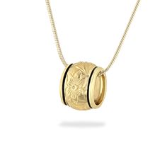 14K Yellow Gold Puka Pendant with black Enamel borders. The Puka pendant measures approximately 10mm in width. Please note that the chain featured in the image is not included with the purchase of this pendant.