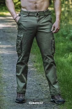 Unique cargo pants made from green high-density twill that will stand the test of time. They have a vintage garment wash, come with a robust, woven belt and a reinforced backside. With no less than pockets, they will hold and hide most of your belongings. Inspired by the past and made for the modern Viking, the pants come with a Viking twist with Grimfrost's helmet design on the pockets, a belt loop with Viking artwork and Younger Futhark runic circle buttons. #grimfrost Unique Cargo Pants, Viking Artwork, Younger Futhark, Cargo Pants Green, Modern Viking, Tactical Wear, Lycra Men, Mens Fashion Edgy, Cowboy Outfits