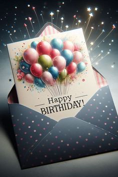 a birthday card with balloons in an envelope