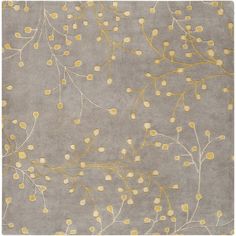 a gray rug with yellow flowers on it