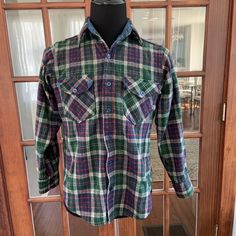 "Vtg. 1990's Woolrich Flannel Shirt Nice clean vintage shape  Quality  Size tag faded out Measures as a Medium  Please use measurements as your guide  15\" Across the Shoulders 22.5\" Sleeves 21\" Armpit to Armpit  27\" Collar to Bottom Length" Vintage Pre-washed Fall Shirt, Vintage Plaid Long Sleeve Tops, Vintage Collared Flannel Shirt, Vintage Flannel Top With Button Closure, Vintage Green Cotton Flannel Shirt, Vintage Flannel Button-up Shirt, Retro Plaid Flannel Top, Vintage Long Sleeve Flannel Shirt, Vintage Cotton Flannel Shirt For Winter