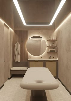 a spa room with a large round mirror