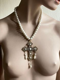 Renaissance filigree cross necklace. Cross has teardrop pearls. Setting are pearl and crystals Comes on a pearl chain. The chain is approximately 50 cm I have used 10 mm glass pearls for the chain If you need a different length please contact me for custom order Elegant White Crucifix Pearl Necklace, Elegant Cross-shaped Pearl Necklace For Wedding, Elegant Pearl Cross Necklace With Pearl Drop, Cross-shaped Pearl Drop Necklace, Pearl Cross Necklace With Pearl Drop, Pearl Drop Cross Necklace, Cross Shaped Pearl Drop Necklace, White Cross Pearl Drop Necklace, White Pearl Cross Necklace With Pearl Drop