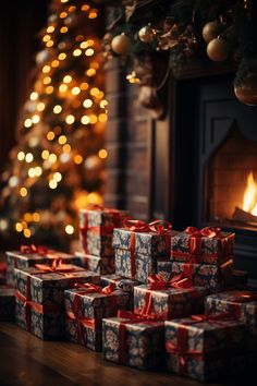 many wrapped presents sitting in front of a fireplace with a christmas tree and lit lights