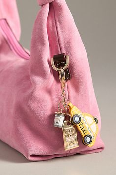 Charming new-trend alert: jewelry for your bag. Showcasing memorable motifs from your favorite cities, this adorable accessory can double as a bag charm and a key chain. | City Bag Charm by Anthropologie in Yellow, Women's, Polyurethane/Zinc Spring Bags 2024, Rectangular Logo Bag Charm, Rectangular Bag Charm With Lobster Clasp For Everyday Use, Rectangular Travel Bag With Keychain, Bag Quotes Handbags, Purse Accessories Ideas, Bag Charms Ideas, Bag Trends 2024, Bag Charm Trend 2024