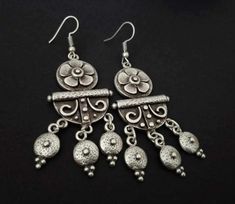 Antique Silver Plated Moroccan Earrings, Ethnic Earrings, Bohemian Silver Plated Earrings, Tribal Earrings, Ethnic Jewelry Antique silver decorative earrings with a tribal, ethnic feel. These earrings are sterling silver plated zamak with a matte, antique oxidized finish. Measurements: 7 cm / 2.75 in They are easy to wear and will not drag the earlobe down. Zamak is an alloy of zinc, aluminum, magnesium and copper. It is hypoallergenic and has a 925 sterling silver coat with an antique, matte fi Nickel Free Metal Danglers For Festive Occasions, Nickel-free Metal Danglers For Festive Occasions, Festive Nickel-free Metal Danglers, Nickel-free Festive Danglers, Bohemian Silver Chandelier Earrings For Festive Occasions, Bohemian Sterling Silver Danglers With Latkans, Intricate Design Metal Drop Danglers, Festive Silver Nickel-free Chandelier Earrings, Intricate Metal Drop Danglers