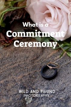 a wedding ring laying on the ground next to flowers