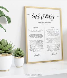 a white and gold framed print with the words our vows in cursive font