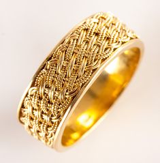 18k Yellow Gold Woven Style Wedding Anniversary Band Ring 5.22g 7.1mm WidthMetal Information: 18k Yellow GoldTotal Weight: 5.22gBand Width: 7.1mmSize: 6.25Estimated Retail Price: $1065.00OUR PRICE: $850.00SizingMany of our pieces can be re-sized at the buyers request. Please email us if you require our skilled professional services.44781 Fine Jewelry In Yellow Gold For Marriage, Fine Yellow Gold Jewelry For Marriage, Yellow Gold Thick Band Wedding Ring Fine Jewelry, Yellow Gold Wedding Ring With Decorative Band, Yellow Gold Wedding Band With Decorative Detail, Yellow Gold Rings With Decorative Thick Band, 14k Yellow Gold Wedding Ring With Decorative Band, Luxury Jewelry With Decorative Band For Marriage, Heirloom 22k Gold Wedding Rings