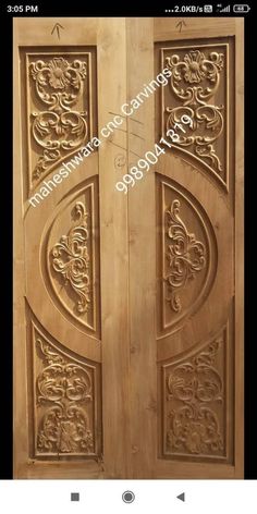 an ornate wooden door with carvings on it