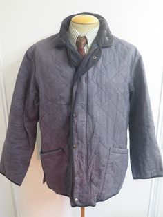 Description:  Barbour Quilted Jacket Manufacturer: J Barbour & Sons Ltd (Barbour) whose Trade mark rights we respect. Style: D211 Duracotton Polar Quilt Colour: Blue Size: L this equates to 42-44" Euro 52-54 Measurements: Chest size 44” (112 cm) Underarm Pit to underarm pit 24” (61 cm) Underarm pit to cuff (internal seam) 19” (48 cm) Collar to cuff 31” (79 cm) Length from nape of neck excluding collar to hem 30” (76 cm) Condition: Very good. It has been worn and will show signs of light wear. Th Trade Mark, Nape Of Neck, Press Studs, Mens Accessories