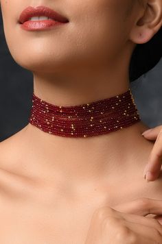 Red Stones Choker Necklace Length - 14 inches DETAILS -100% top Quality -22K gold plated silver copper alloy. -Handcrafted in our all girls workshop in Paisley Pop Studio, Jammu and Kashmir STYLE TIP A simple even dull outfit will almost always look transformed into something special with the right jewellery and accessories. You can choose this choker necklace to bring a simple outfit to life. This look perfect when you are wearing a traditional or indo-western outfit. Handcrafted in Jammu and K Red Round Beads Temple Jewelry, Temple Jewelry Style Gold Plated Choker, Gold Plated Temple Jewelry Choker As Gift, Ruby Necklaces For Festivals And Gifts, Polished Beads Choker Necklace For Gifts, Gold Plated Choker For Festivals As A Gift, Gold Plated Choker For Festivals And Gifts, Red Jewelry With Gold Beads For Gifts, Festive Red Gold-plated Jewelry