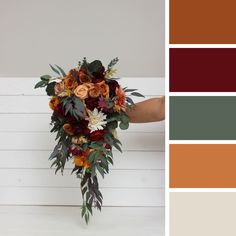 a bouquet of flowers sitting on top of a table next to a color swatch