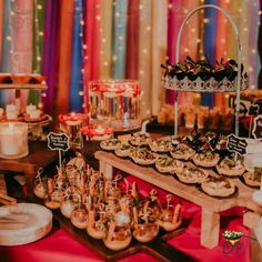 a table filled with lots of food and desserts