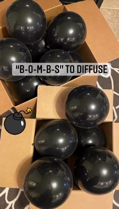 some black balls are in a box and one is on top of the other boxes