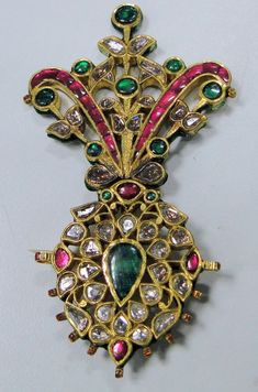 A beautiful rare find antique turban pin from the house of Maharaja of Rajasthan, encrusted with old mine cut Diamonds, Rubies, Emeralds set in 20 carats solid Gold and back adorned with multicolor enamel exquisite work, Detailed Kundan Meen work an Original classic collectors piece which could be easily adopted into two individual pendants or Brooch and a pendant. a very versatile piece in good condition. Size of piece-9.5/5.5 cm, total weight-45.6 grams(1.60 ounces). Material-solid 20 carat go Traditional Ceremonial Brooch Jewelry, Dhoti Function, Rajput Wedding, Mughal Jewelry, Wedding Symbols, Royal Diamond, Polki Necklace, Ruby Emerald, Turkish Jewelry