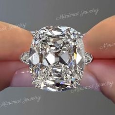 "16 CT Old mine Cushion cut moissanite engagement ring,Three stone moissanite ring,big large cushion moissanite cluster 3 stone wedding ring → Occasions: Engagement & Wedding DESCRIPTION -------------------- STYLE :three stone *Moissanite Details →Main Stone :Old mine Cushion →Size (mm) :16*13 →Carat weight : 16 →Band & Halo & Side Stone :shield →Size (mm) :0.55 →Carat Weight :1.37 →Stone Total CTW :17.37 → Color : Colorless →Clarity :VVS →Metal :SOLID (10K/14K/18K )GOLD →Band Width :3mm * Purch 3 Stone Wedding Ring, Edwardian Wedding Ring, Elongated Cushion Cut Engagement Ring, Big Diamond Rings, Cushion Cut Moissanite Engagement Ring, Moissanite Engagement Ring Cushion Cut, Stone Wedding Ring, Baguette Engagement Ring, Plus Size Rings