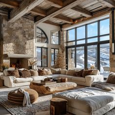 a living room filled with lots of furniture next to a large window covered in snow