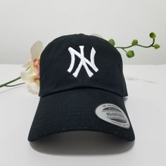 This NY Yankees Hat, Upside down NY Dad Hat. One size fits all. NY is Raised embroidered in the front for a great look -One size fits most with an adjustable buckle closure, fitting up to XL size. -Adult/Unisex. -Embroidered in the U.S. Trendy Baseball Season Visor Hat, Trendy Visor Hats For Baseball Season, Casual Baseball Cap With Short Brim For Baseball Season, Trendy Dad Hat With Letter Print And Short Brim, Casual Mini Hat With Curved Brim, Casual Short Brim Hat For Baseball Season, Casual Mini Hats With Short Brim, Casual Mini Hat With Short Brim, Trendy One Size Fits Most Fitted Hat