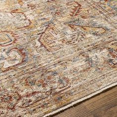 an area rug with wooden floors and wood flooring on top of it, in the middle