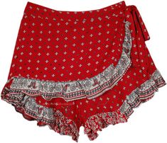 These shorts feature a trendy front wrap skirt design, combining the breeziness of shorts with the femininity of a skirt.  The delicate paisley pattern adds a touch of sophistication and bohemian charm to these shorts. #tlb #WrapAroundSkirt #Fairycoreshorts #VacationShortSkirt #BeachSkirt Bohemian Printed Summer Shorts, Red Casual Wrap Skirt For Summer, Casual Red Wrap Skirt For Summer, Bohemian Mini Shorts For The Beach, Bohemian Mini Length Beach Shorts, Bohemian Short Mini Skirt, Bohemian Style Short Mini Skirt, Summer Cotton Wrap Bottoms, Summer Wrap Cotton Bottoms