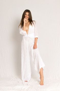 White sheer jumpsuit with sleeves, open V neckline and georgette silk lining Beachy V-neck Swimwear For Spring, Chic V-neck Beach Dress For Loungewear, Chic V-neck Beach Dress, V-neck Beach Season Loungewear Cover-up, V-neck Summer Beach Dress For Loungewear, V-neck Cover-up For Beach Season Loungewear, Summer V-neck Beach Dress For Loungewear, Summer V-neck Beach Dress Loungewear, V-neck Cover-up For Beach Season