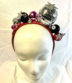 Add holiday spirit to your hairstyle with this fun, bright , tacky headband ! Handmade using festive holiday ornaments that sparkle and shine, set on a 1 inch wide, satin headband . Each unique headband is handcrafted with great care and  attention to detail . A perfect and fun  accessory for all of your holiday festivities!  Headband is 13 inches from end to end, over the head .   Headband contains small embellishments that can be a choking hazard to small children.  HANDLE EMBELLISHED HEADBAND Disco Ball Headband, Christmas Disco, Disco Christmas, Embellished Headband, Headband Handmade, Unique Headband, Satin Headband, Silver Headband, Embellished Headbands