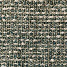 an up close shot of the texture of a tweed fabric